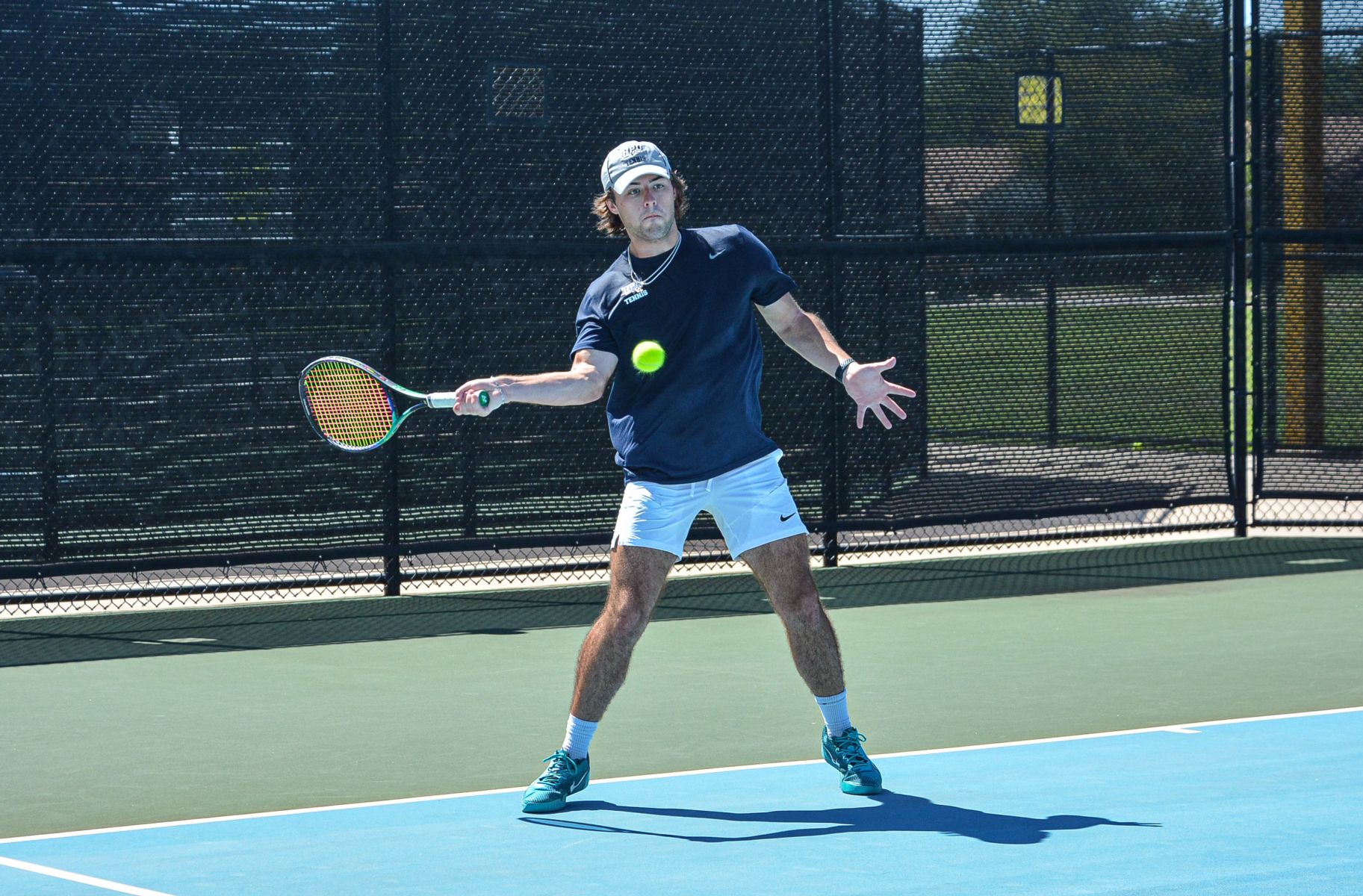 HPU Male Tennis Player Action Shot